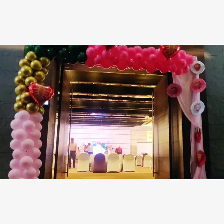 Get Berry First Birthday Decor with pink and gold balloon entrance decoration for a birthday celebration