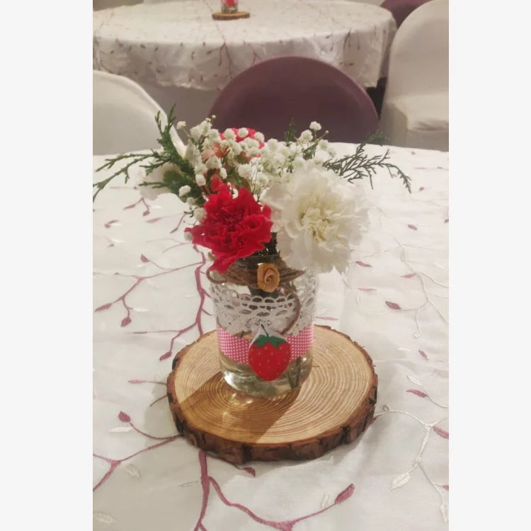 Book Berry First Birthday Decor with strawberry-themed floral table centrepiece
