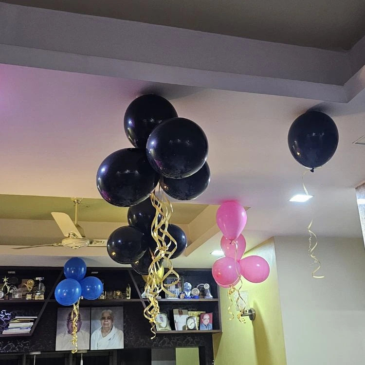 Get birthday ceiling balloon bunch decoration at home with blue pink and black balloons