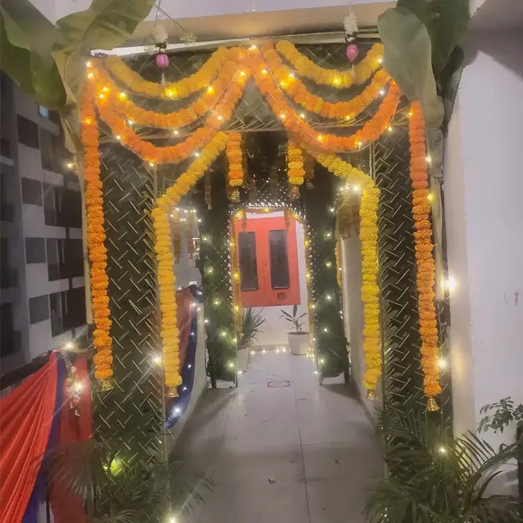 Book Chapra Decoration with floral garlands, banana leaves and entrance lighting