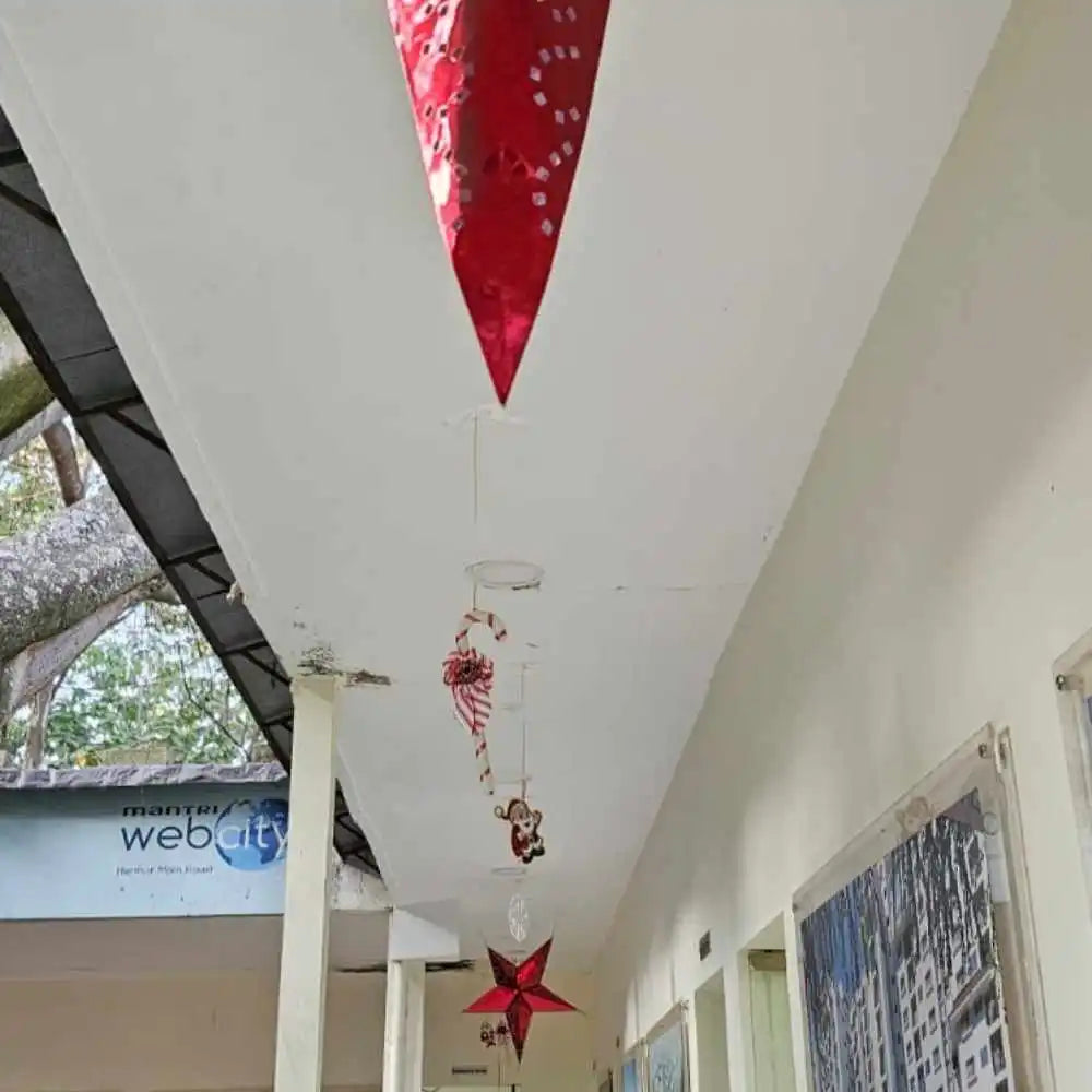 Hire Christmas office ceiling decoration with hanging star ornaments