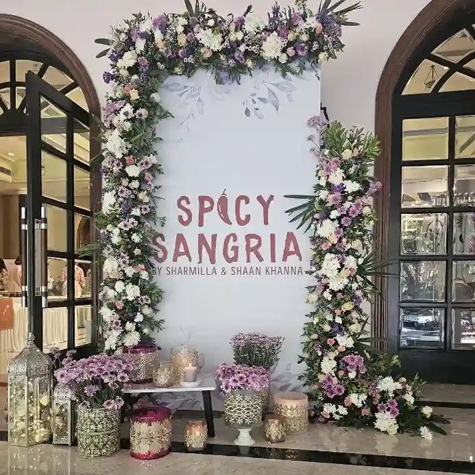 Book custom floral event welcome board with decorative flower arrangements