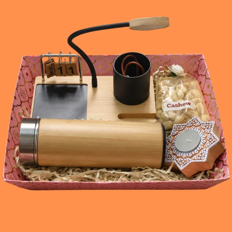 Buy Diwali gift hamper with bamboo bottle, cashews and wooden candle