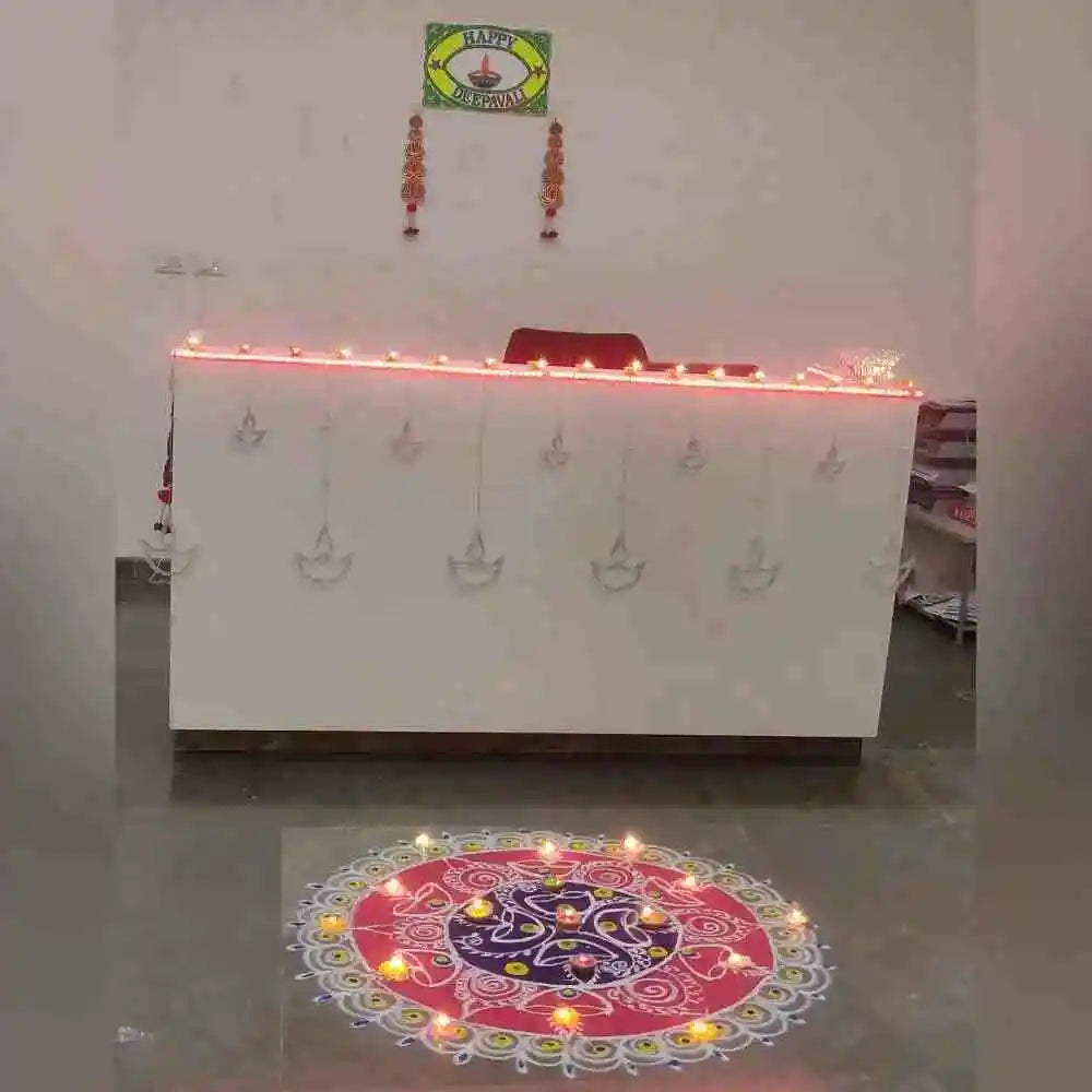 Order Diwali Decor in Office with colourful rangoli, diyas and festive reception lighting decoration