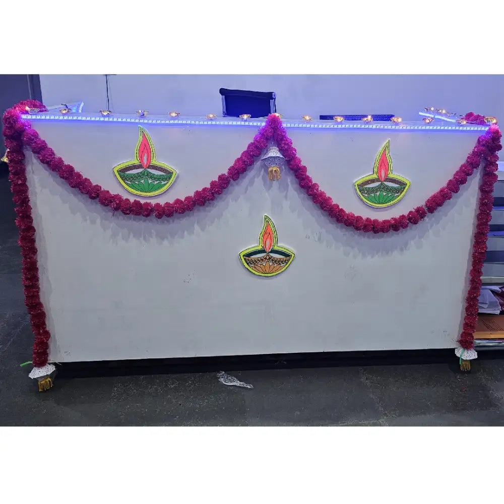 Book Diwali Decor in Office with diya wall hangings and decorative floral garland for festive office decor