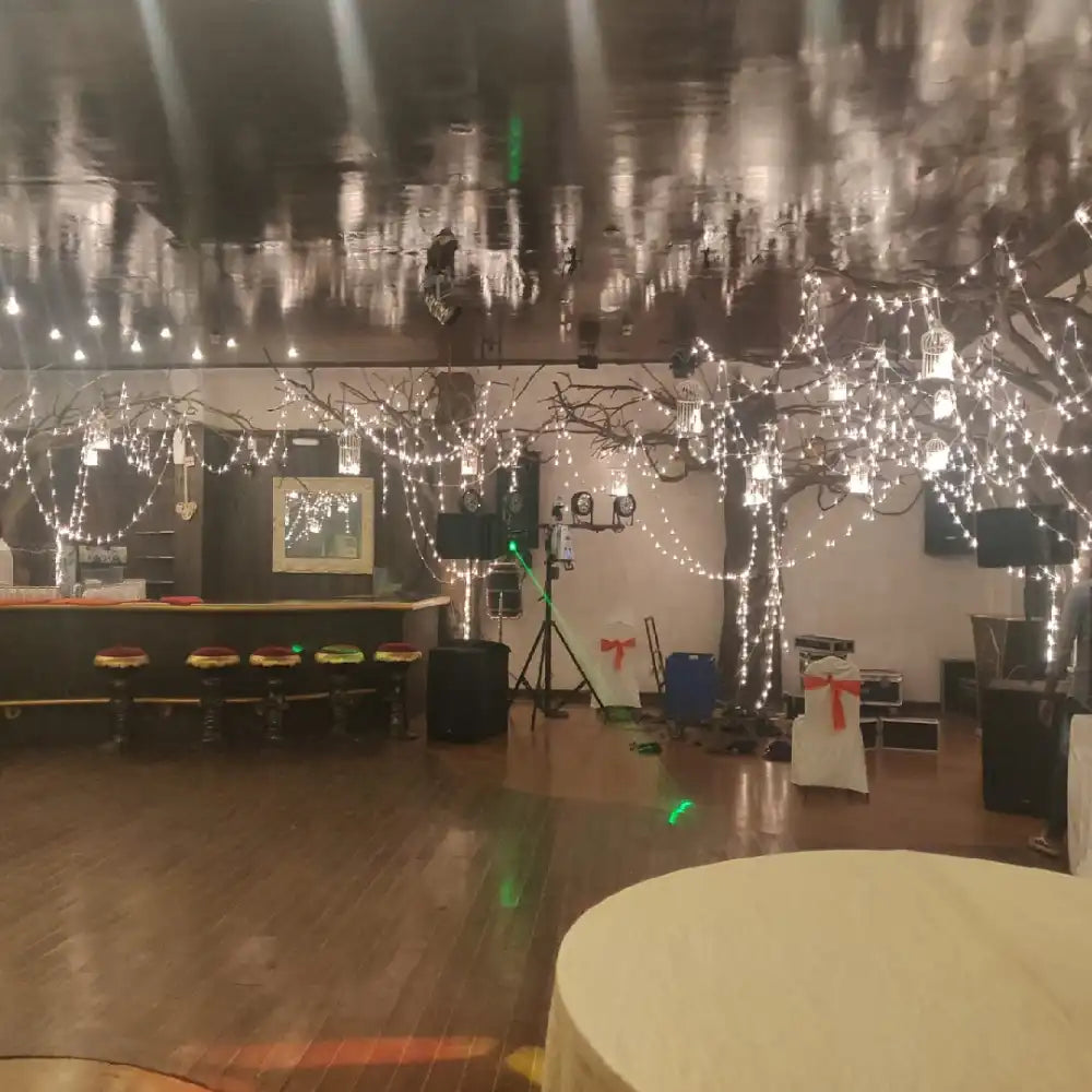 Order Elegant Floral Wedding Decor with fairy lights and illuminated wedding venue setup