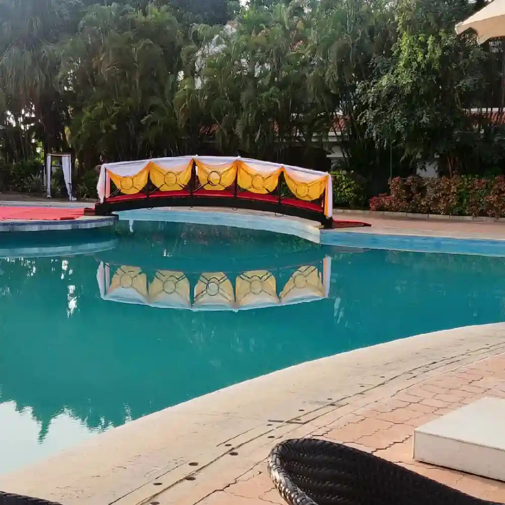 Book Elegant Floral Wedding Decor with poolside floral bridge decoration