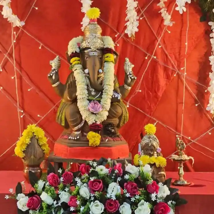 Book Ganesh Chaturthi floral decoration for Ganesha idol and flower arrangement