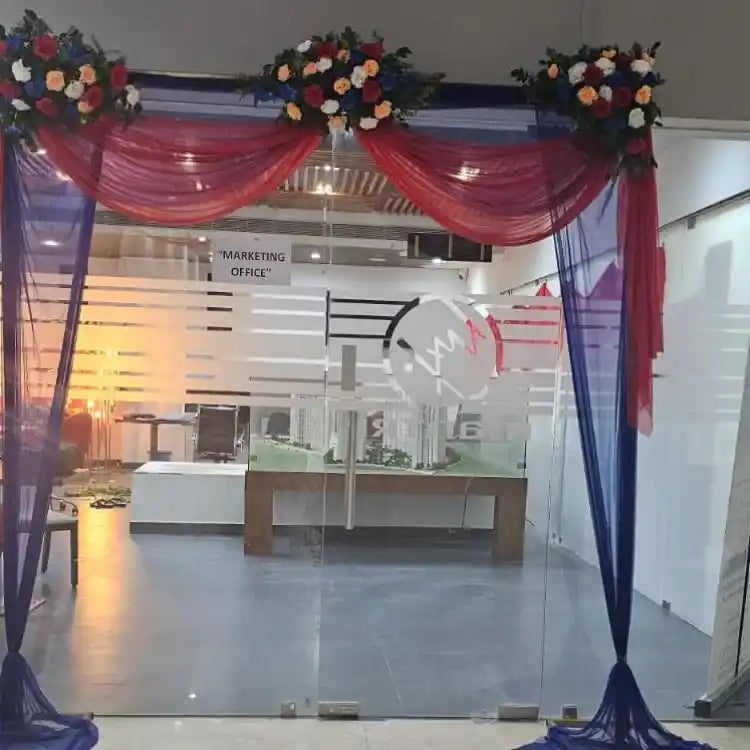 Enquire about Ganesh Chaturthi office entrance decoration with floral drapes
