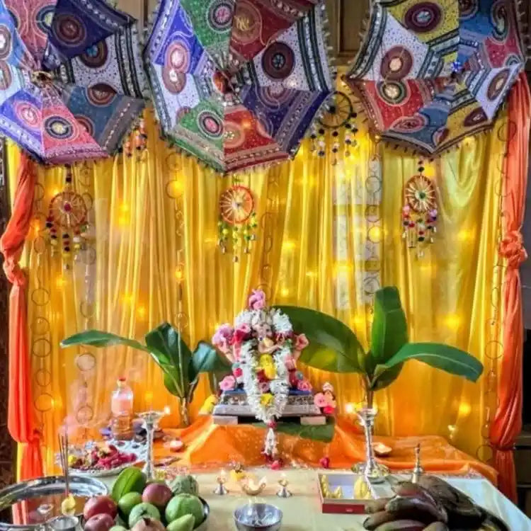 Enquire about traditional Ganesh Chaturthi puja decoration with floral backdrop