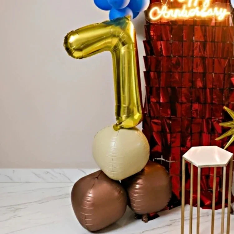 Book anniversary decoration with gold number balloon, blue balloons and red backdrop