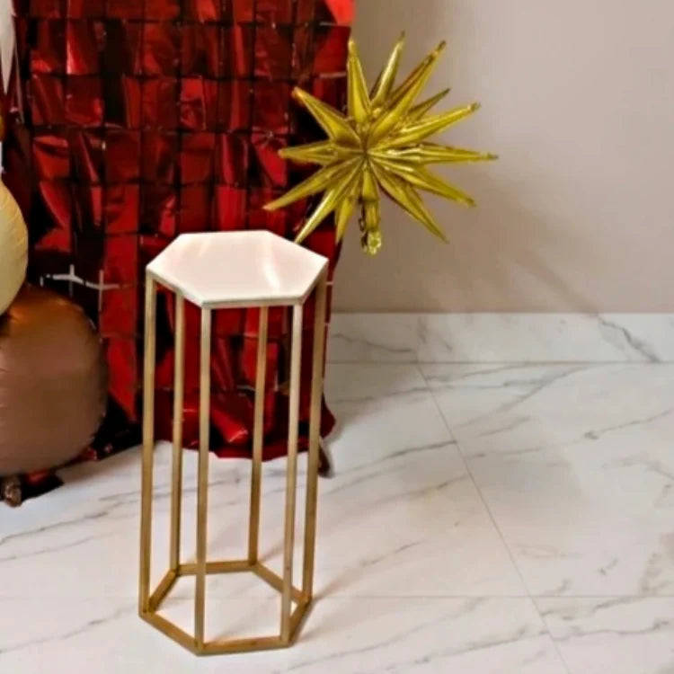 Hire anniversary decoration service with gold and red table decor and backdrop