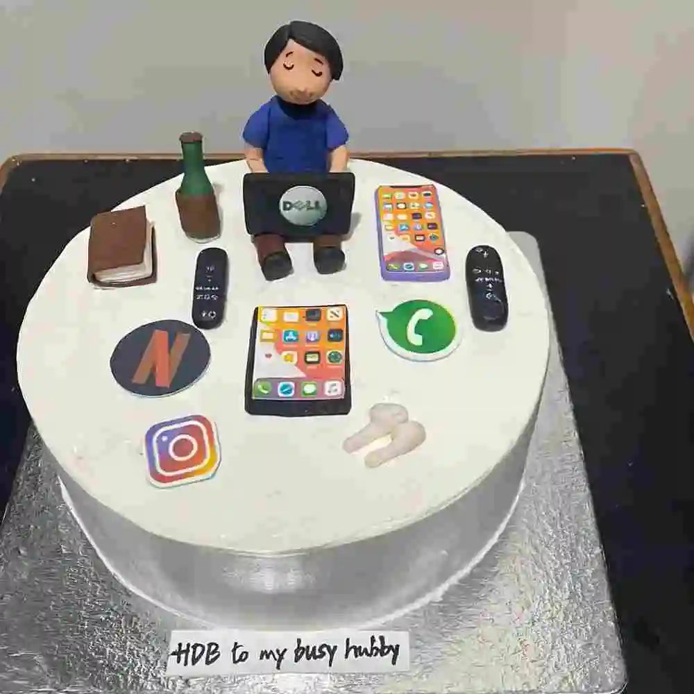 Order a busy husband birthday cake with gadget decorations online
