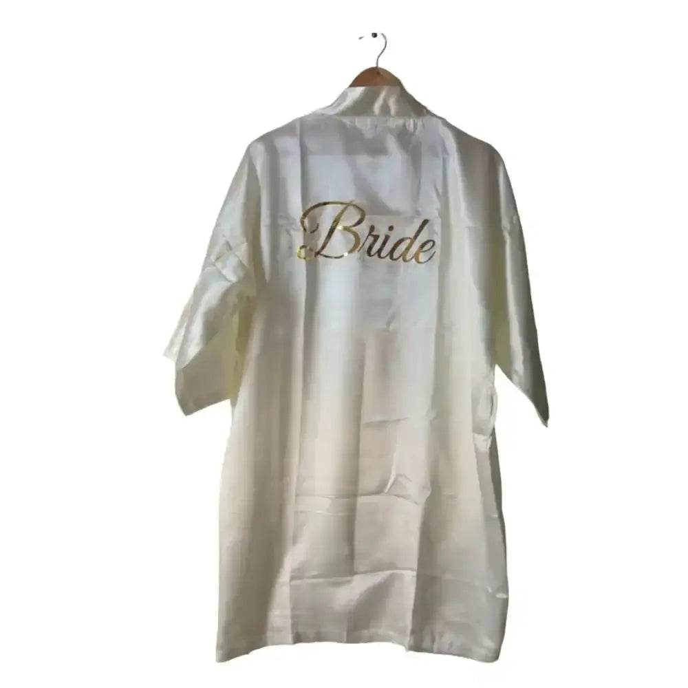 Buy ivory satin bride bathrobe with gold lettering for wedding preparations