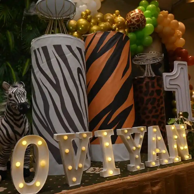 Order jungle safari birthday decor package with animal themed cake table decorations