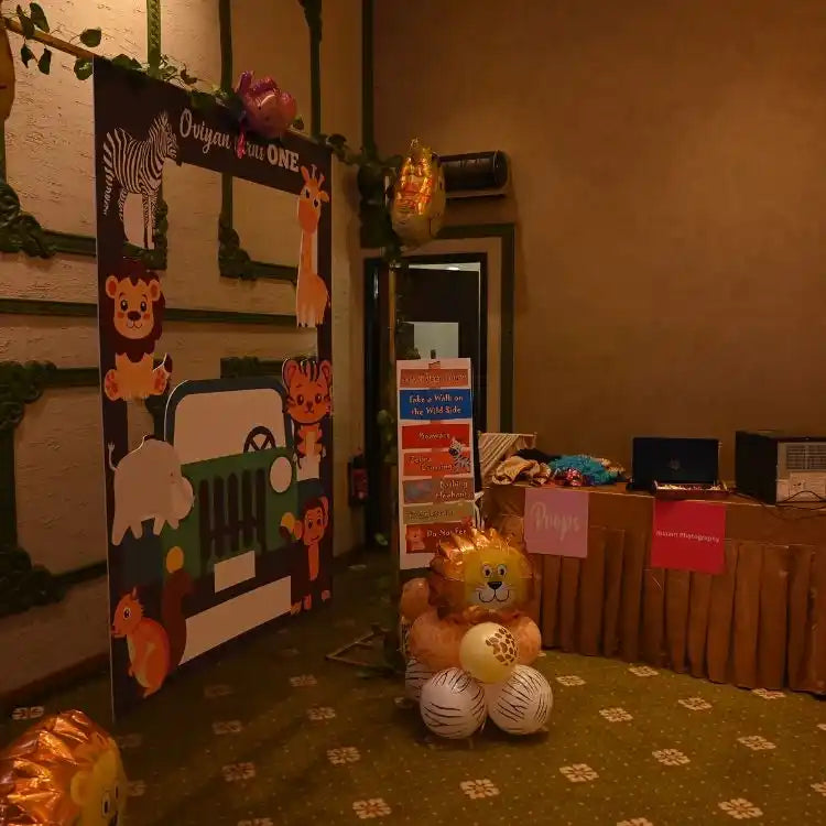 Book jungle safari birthday decor package with animal backdrop and balloon decorations at venue