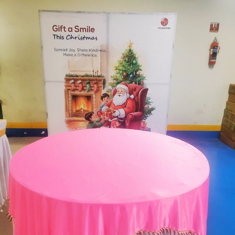 Book Christmas office backdrop decoration with pink table setup and festive display
