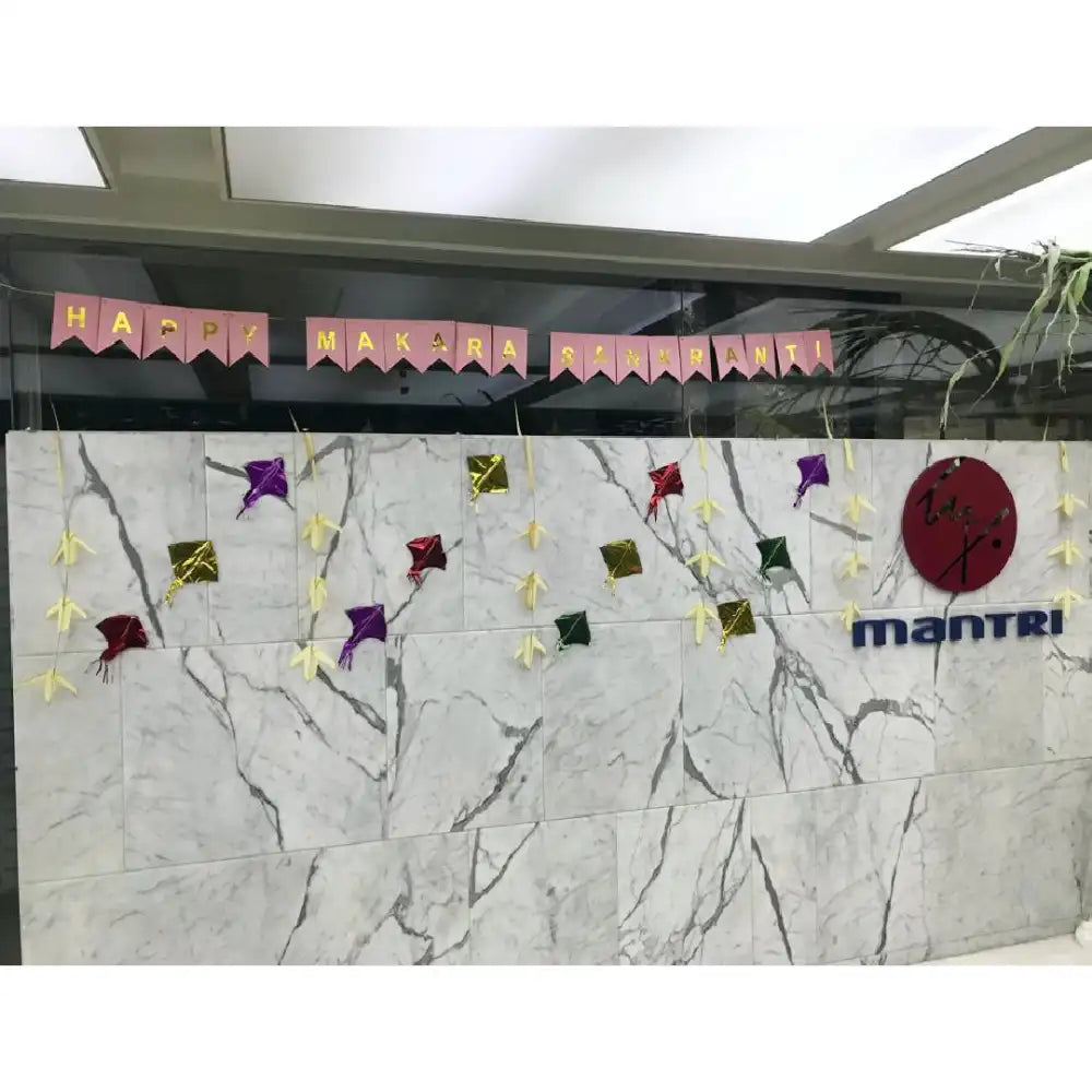 Enquire Pink Pongal office decoration with festive banner and colorful kites