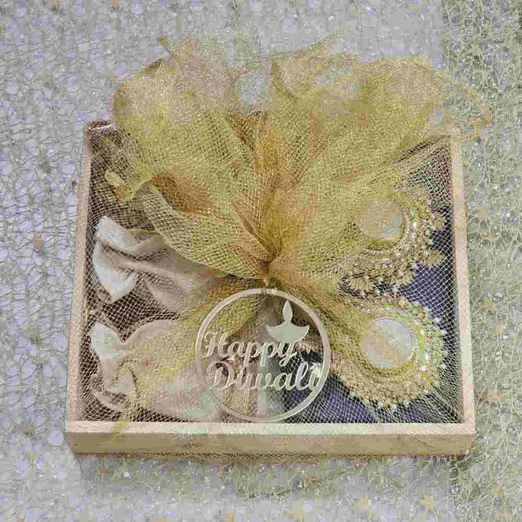 Buy premium Diwali hamper in decorative net gift packaging online