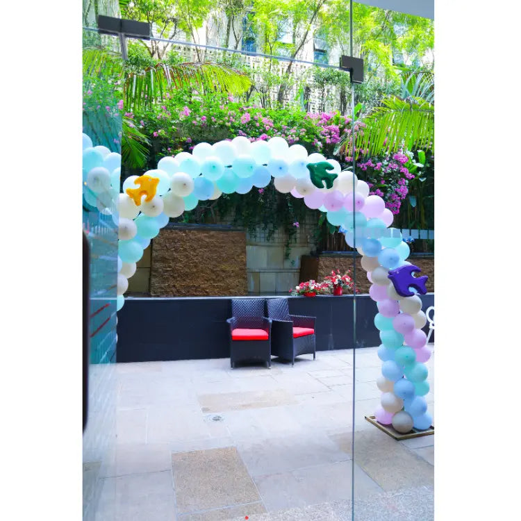 Order Under the Sea Birthday Decor with ocean-themed balloon arch and sea animal cutouts at the entrance