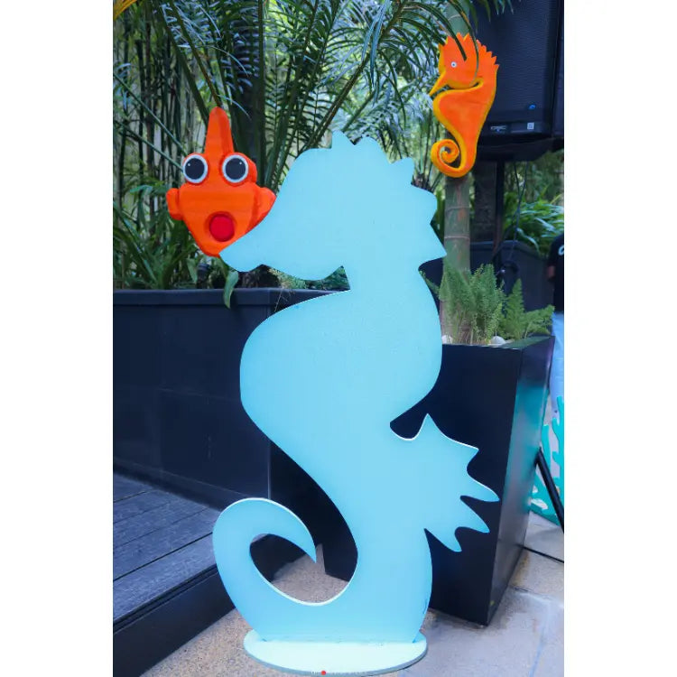 Book Under the Sea Birthday Decor with large seahorse cutout and sea-themed decorations