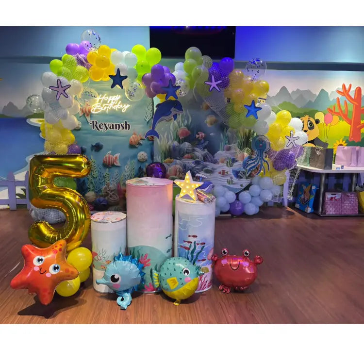 Book Underwater World Birthday Decor with colorful ocean-themed balloon decorations and backdrop