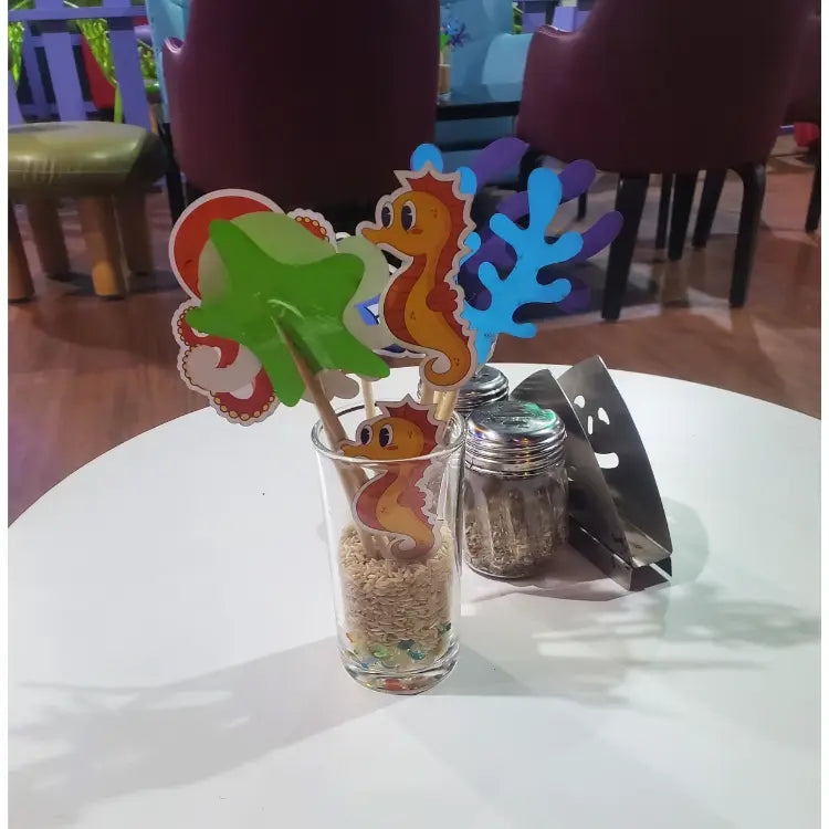 Book Underwater World Birthday Decor with colorful sea life table props and ocean-themed decorations