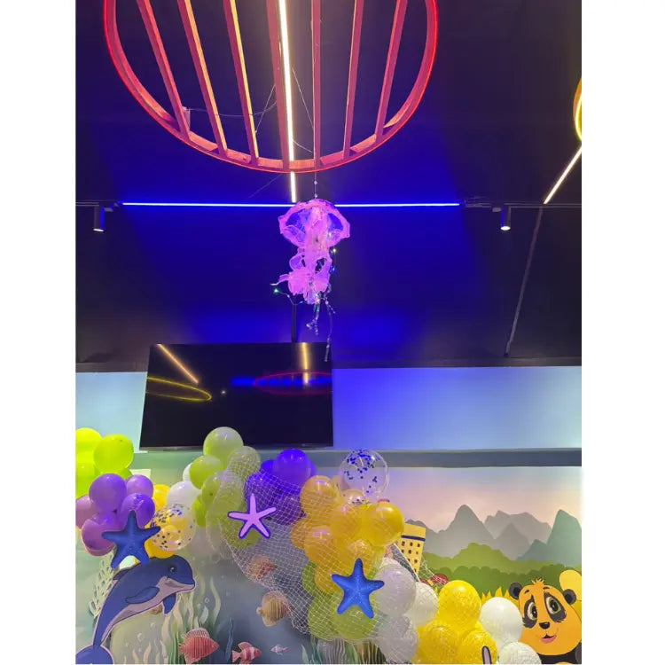 Get Underwater World Birthday Decor with hanging jellyfish and ocean-themed balloon decorations