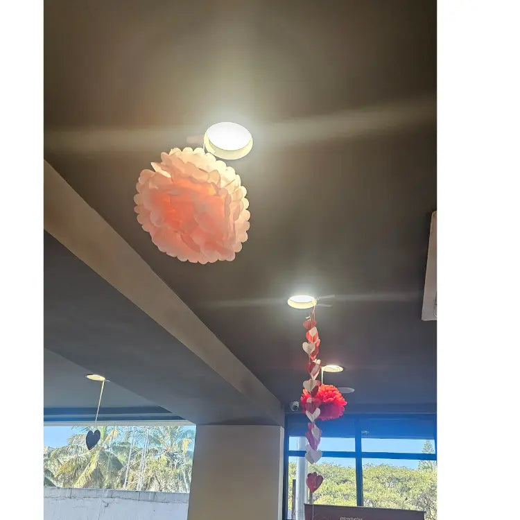 Get Valentine's Day ceiling decor with hanging hearts and pompoms