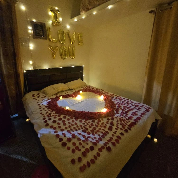 Enquire about wedding night romantic room decoration with floral heart and candles